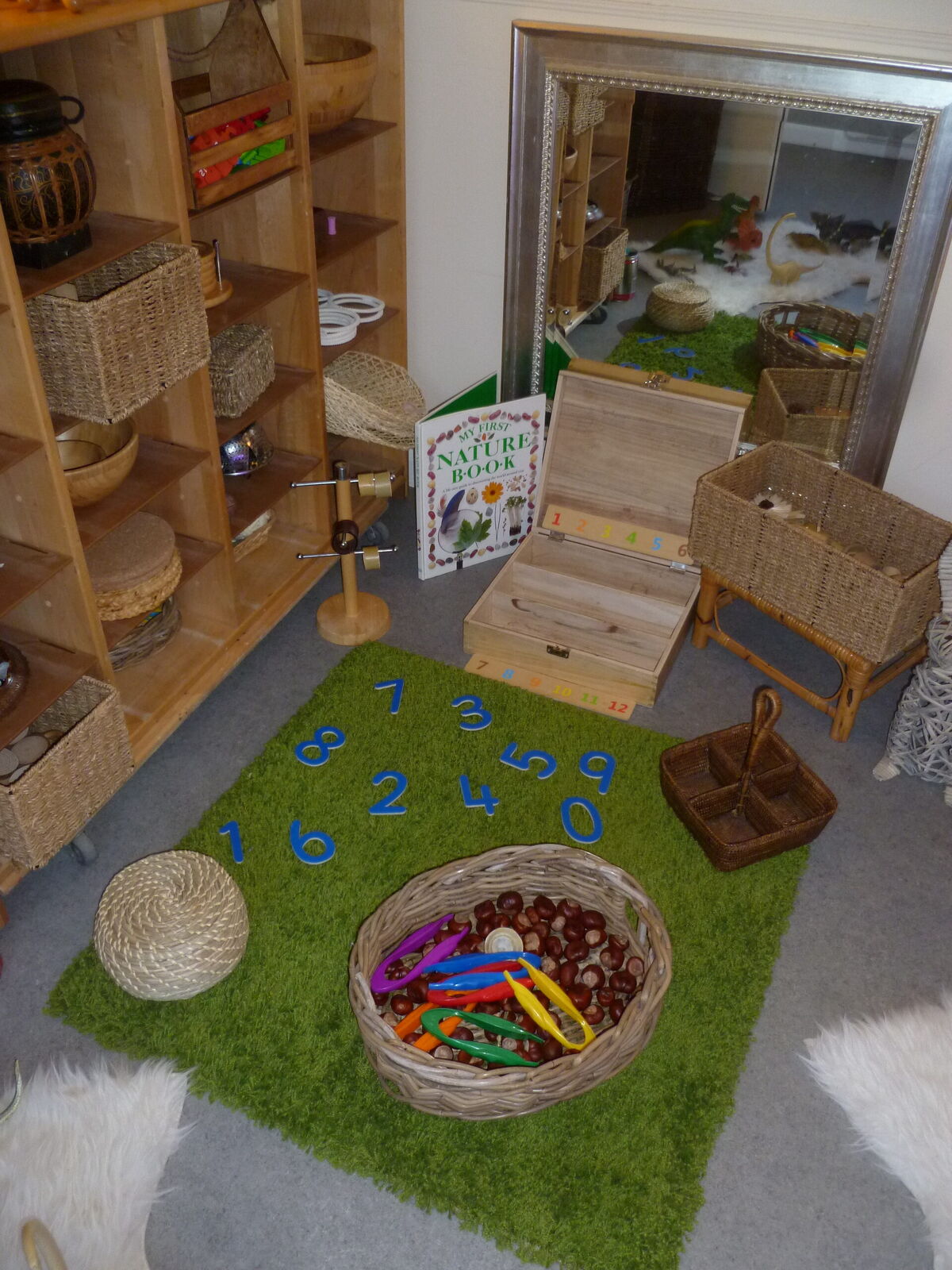 The indoor room with a mirror, wooden furniture and a number rug
